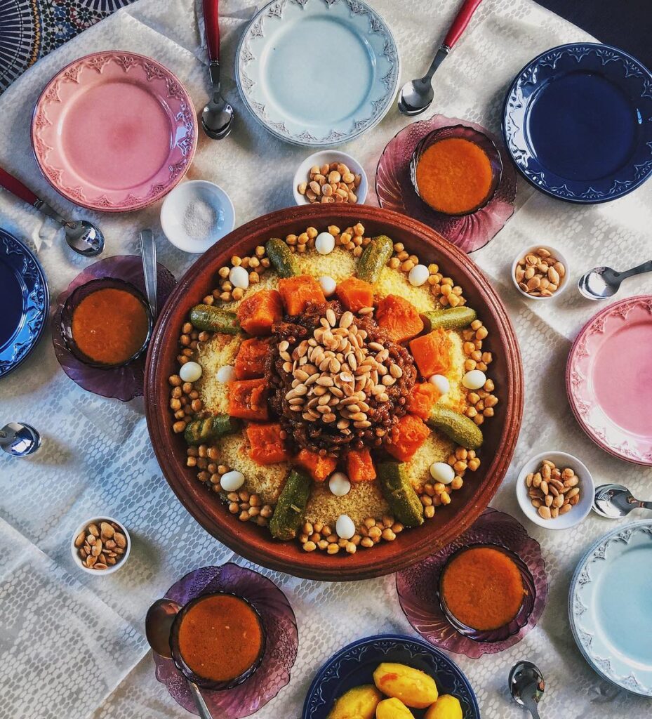 Delicious Moroccan couscous served in a traditional ceramic bowl, topped with colorful vegetables, tender meat, and aromatic spices, showcasing the rich culinary heritage of Morocco