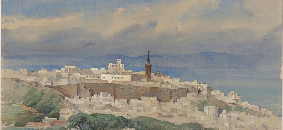 Panoramic view of a historic Kasbah overlooking the Mediterranean Sea, with its traditional architecture and vibrant coastal landscape