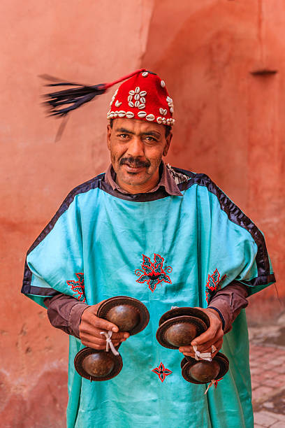 Colorful collage showcasing various Moroccan music festivals, featuring musicians performing traditional instruments, vibrant crowds enjoying the celebrations